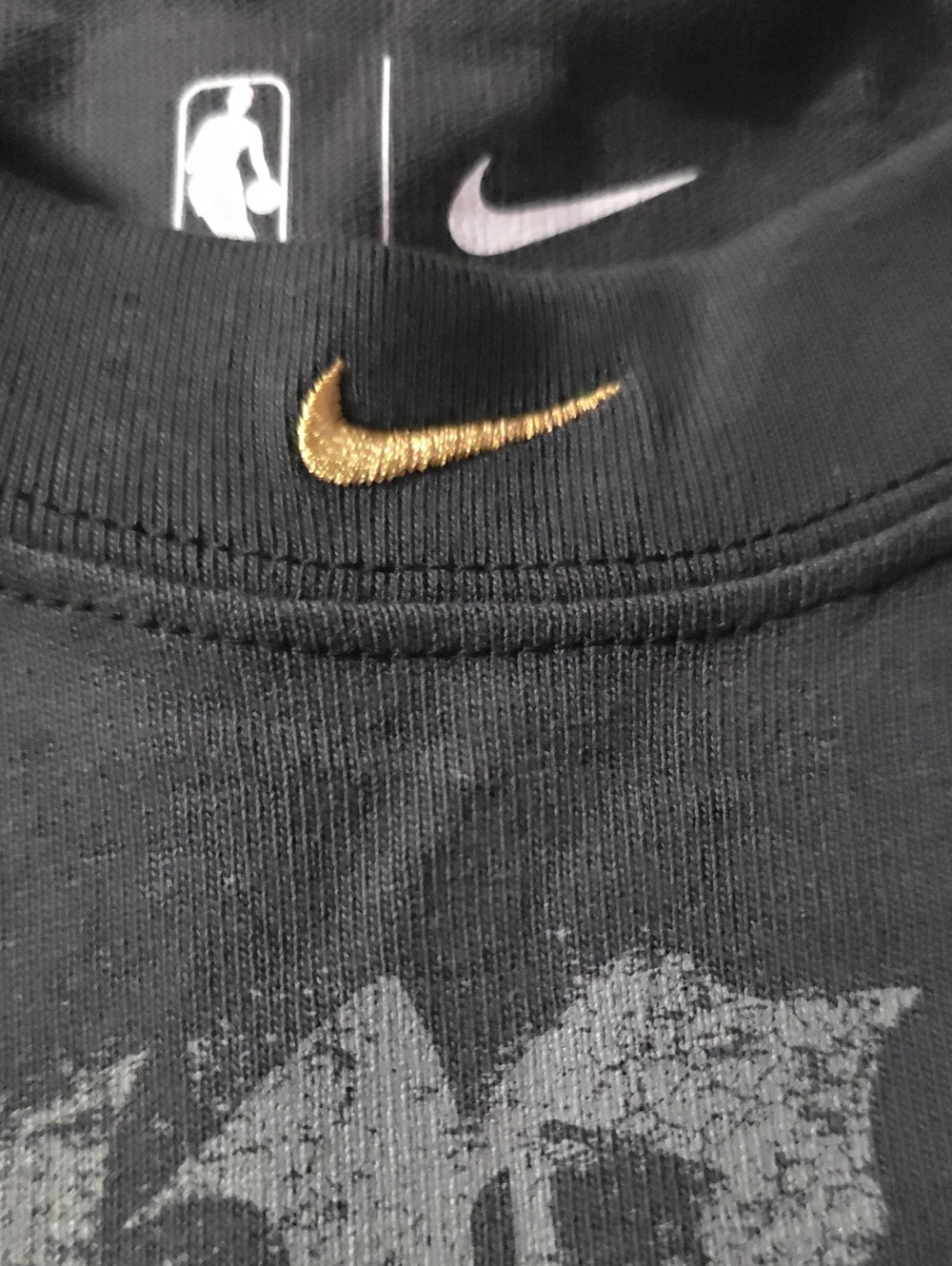 Brand New Knicks Champipnship Nike Black Tee with Gold Trophy Accent Size XXL.